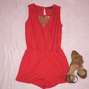 Red romper with open back slit